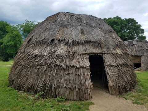 brown straw or wood house or hut with door