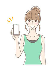 笑顔でスマホの画面を見せる正面向きの女性