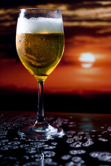 Glass of beer on a sunset