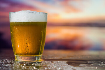Glass of beer on a sunset