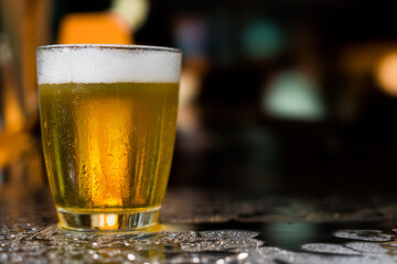 Beer glass on the bar counter.