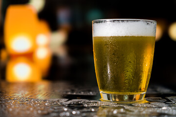 Beer glass on the bar counter.