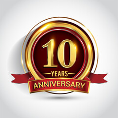 10th golden anniversary logo with ring and red ribbon isolated on white background
