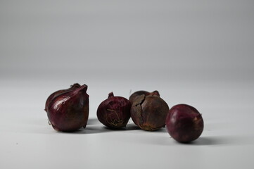 A heap of onions on white background.