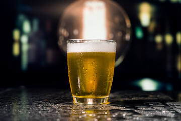 Beer glass on the bar counter.
