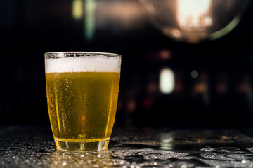 Beer glass on the bar counter.