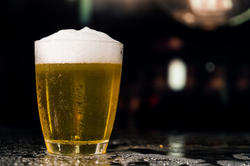 Beer glass on the bar counter.