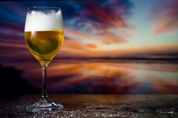 Glass of beer on a sunset
