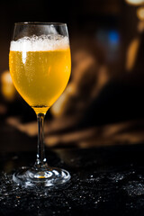 Beer glass on the bar counter.