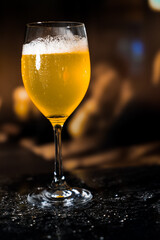 Beer glass on the bar counter.