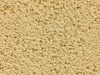 Texture concrete block wall yellow color. Rugged texture