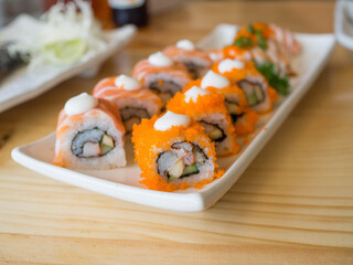 Sushi on a plate,Roll California sushi on white dish.selective focus.

