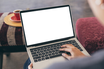 computer mockup image blank screen.hand woman work using laptop with white background for advertising,contact business search information on desk at coffee shop.marketing and creative design