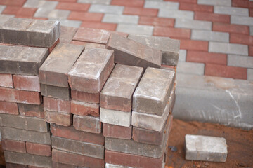 Paving slabs stands in a pile on the street