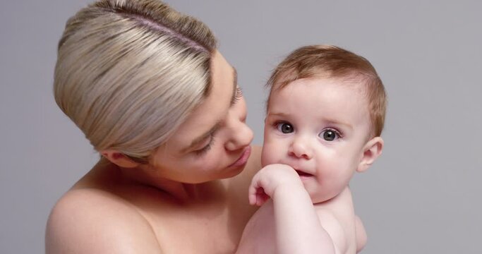 SLO MO CU ZO Young mother kissing baby son (6-11 months)