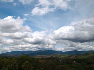 Fototapeta na wymiar Blue sky with beautiful natural white clouds. High mountain scenery.