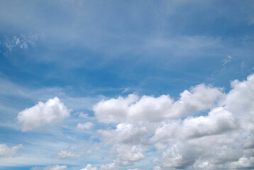Naklejka na ściany i meble Blue sky with beautiful natural white clouds.