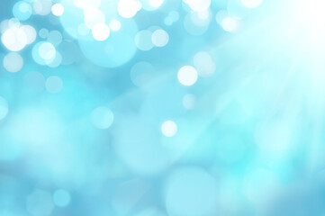 Obraz premium Blue and white bokeh background from natural. Bright glowing blue abstract background in the form of bokeh.