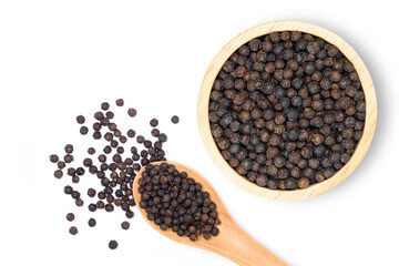 Close up black pepper seeds or peppercorns ( dried seeds of piper nigrum) in wooden bowl and spoon isolated on white background with clipping path. top view. Flat lay.