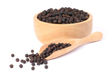 Closeup black pepper seeds or peppercorns ( dried seeds of piper nigrum, piperine ) in wooden bowl and scoop isolated on white background.