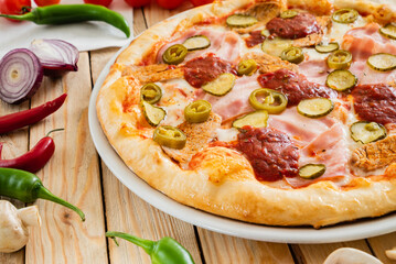 tasty pizza on the wooden background