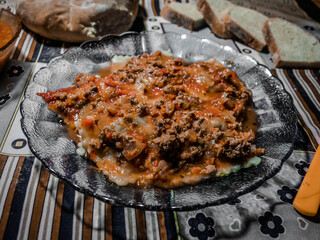 ravioli with bolognese sauce and homemade bread