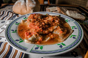 ravioli with sauce and homemade bread