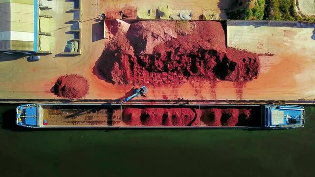 AERIAL was Rocks being loaded in barge in harbor / Merzig, Saarland, Germany