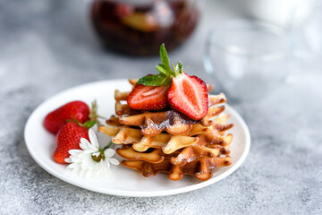 Delicious fresh baked belgian waffles with berries and fruit