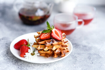 Delicious fresh baked belgian waffles with berries and fruit