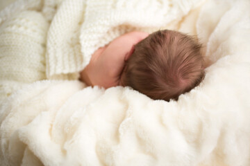Newborn baby with full head of hair