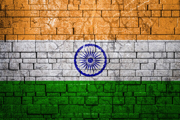Fototapeta na wymiar National flag of India on brick wall background.The concept of national pride and symbol of the country. Flag banner on stone texture background.