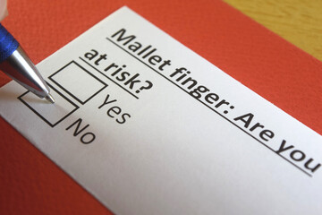 Fototapeta premium One person is answering question about mallet finger.