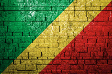 National flag of Republic of the Congo on brick  wall background.The concept of national pride and...