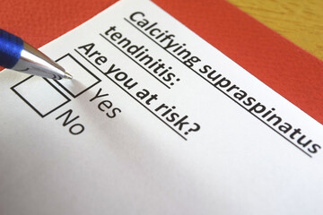 Fototapeta premium One person is answering question about calcifying supraspinatus tendinitis.