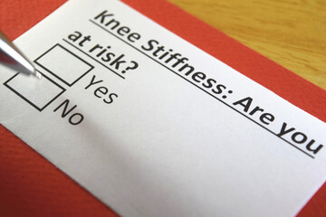Fototapeta premium One person is answering question about knee stiffness.