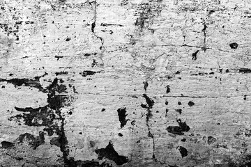 Texture of a concrete wall with cracks and scratches which can be used as a background