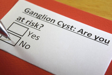 Obraz premium One person is answering question about ganglion cyst.