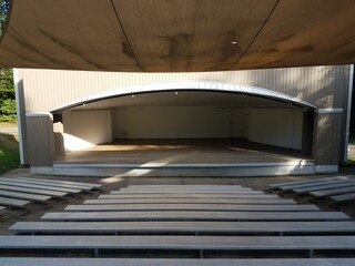 amphitheater with metal seating or benches and stage