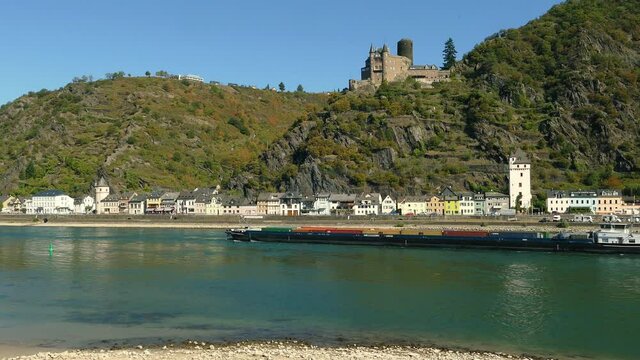 WS Barge on Rhine river passing by St. Goarshausen and Katz Castle / Rhine Valley, Rhineland-Palatinate, Germany