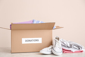Box with donations on table