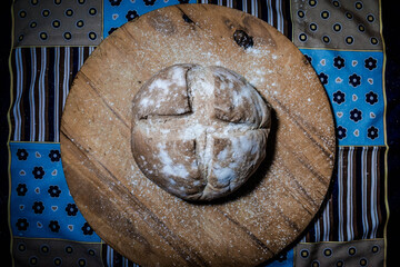 homemade argentinian bread with wooden table background