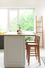Interior of modern kitchen with stylish table