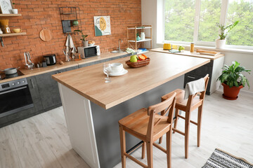 Interior of modern kitchen with stylish table