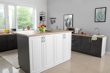 Interior of modern kitchen with stylish table