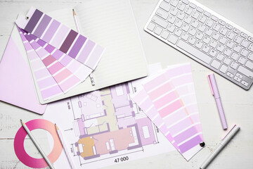 Color palettes with building plan and computer on table