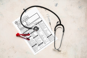 Blood samples in tubes with stethoscope and laboratory test form on white background. Concept of...