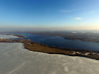 Aerial view of the Dnepr river in Kiev at winter (drone image)