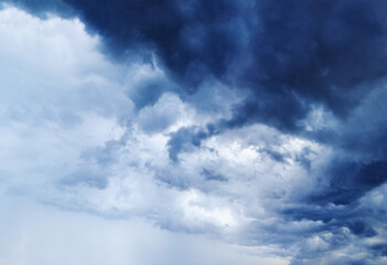 Obraz premium Stormy cloudy sky panorama, dark blue thunderclouds, white fluffy cumulus clouds closeup, rainy thunderstorm landscape, overcast bad weather, cloudiness skies, cloudscape, atmosphere, heaven view, air