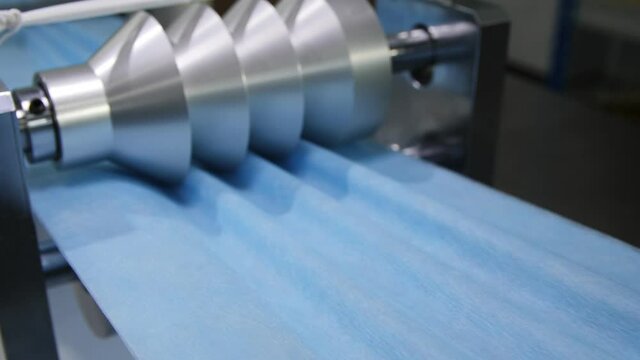 machine makes goffering on fabric strip for protective masks